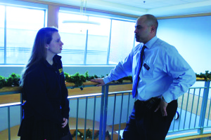 Director of Athletics, Mr. Jason McGhee, having a conversation with Colleen McMahon '17. (Photo Courtesy of Kendall Kaiser)