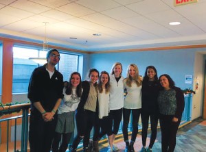 Meet the 2014-2015 Here and Now team at work in our "newsroom." (Photo Courtesy of Lauren Brownlee)
