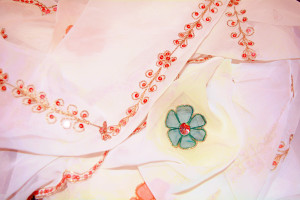 Scott's hijab is simply beaded.